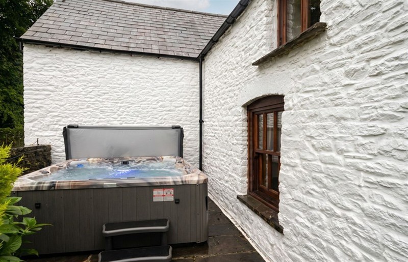 The hot tub at Tynewydd Farmhouse, Tynewydd, Rhondda Cynon Taf